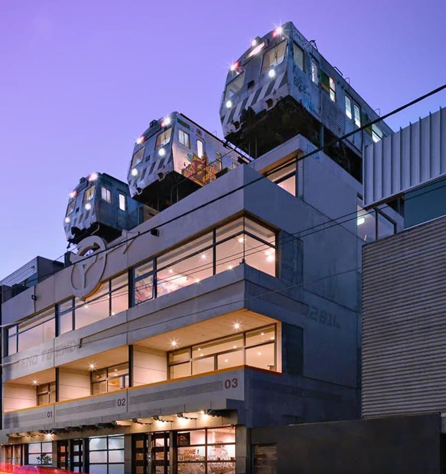 Trainscendence at dusk: train carriages on the roof of 48 Easey Street, Collingwood